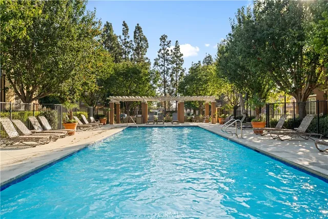 a view of a yard with swimming pool