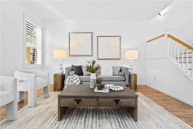 a living room with furniture and a table