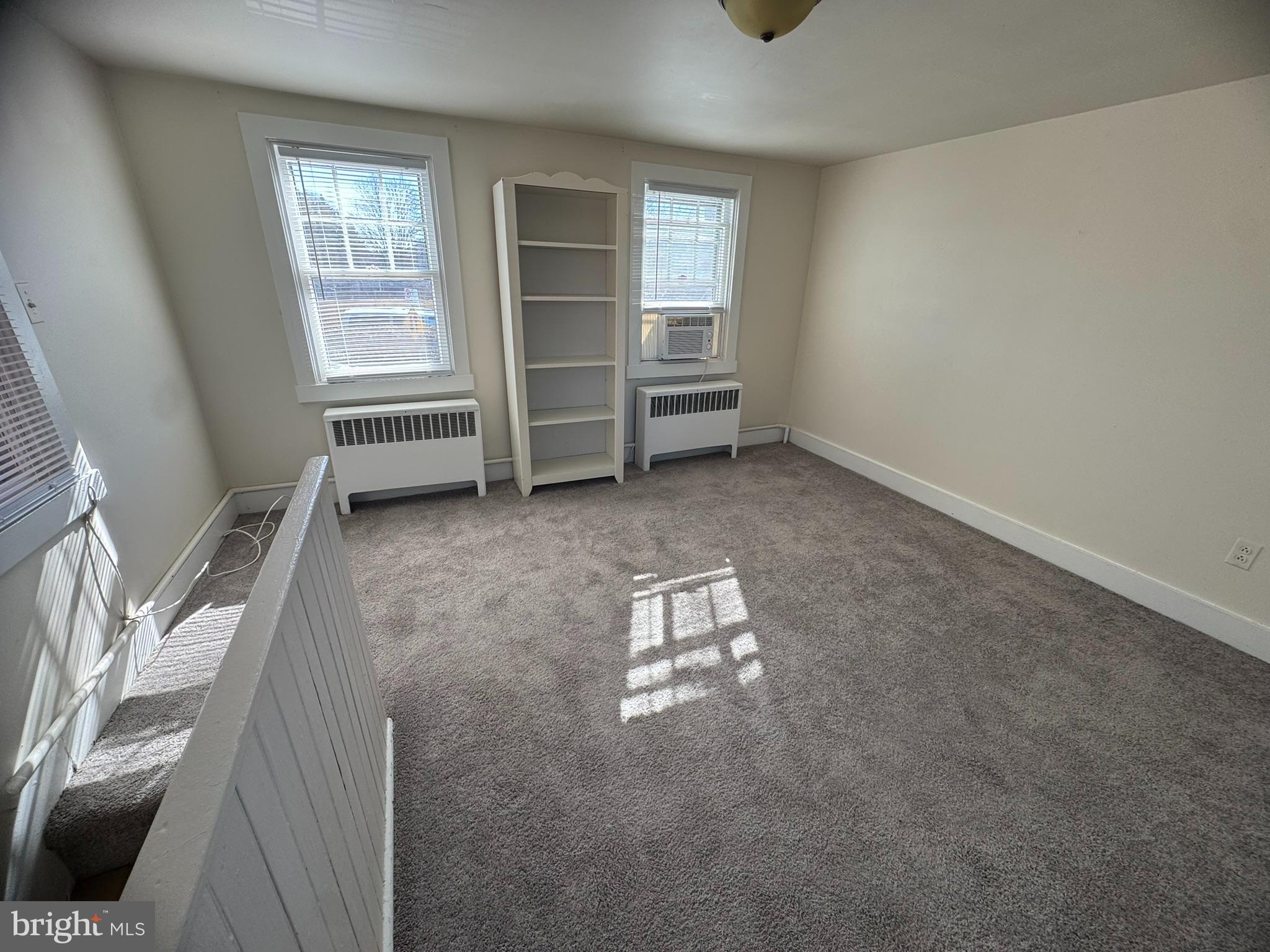 125 South Bentz Street Frederick, MD 21701 - Photo 11 of 16 an empty room with windows and cabinet