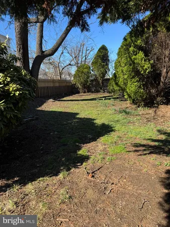 a view of a backyard of the house