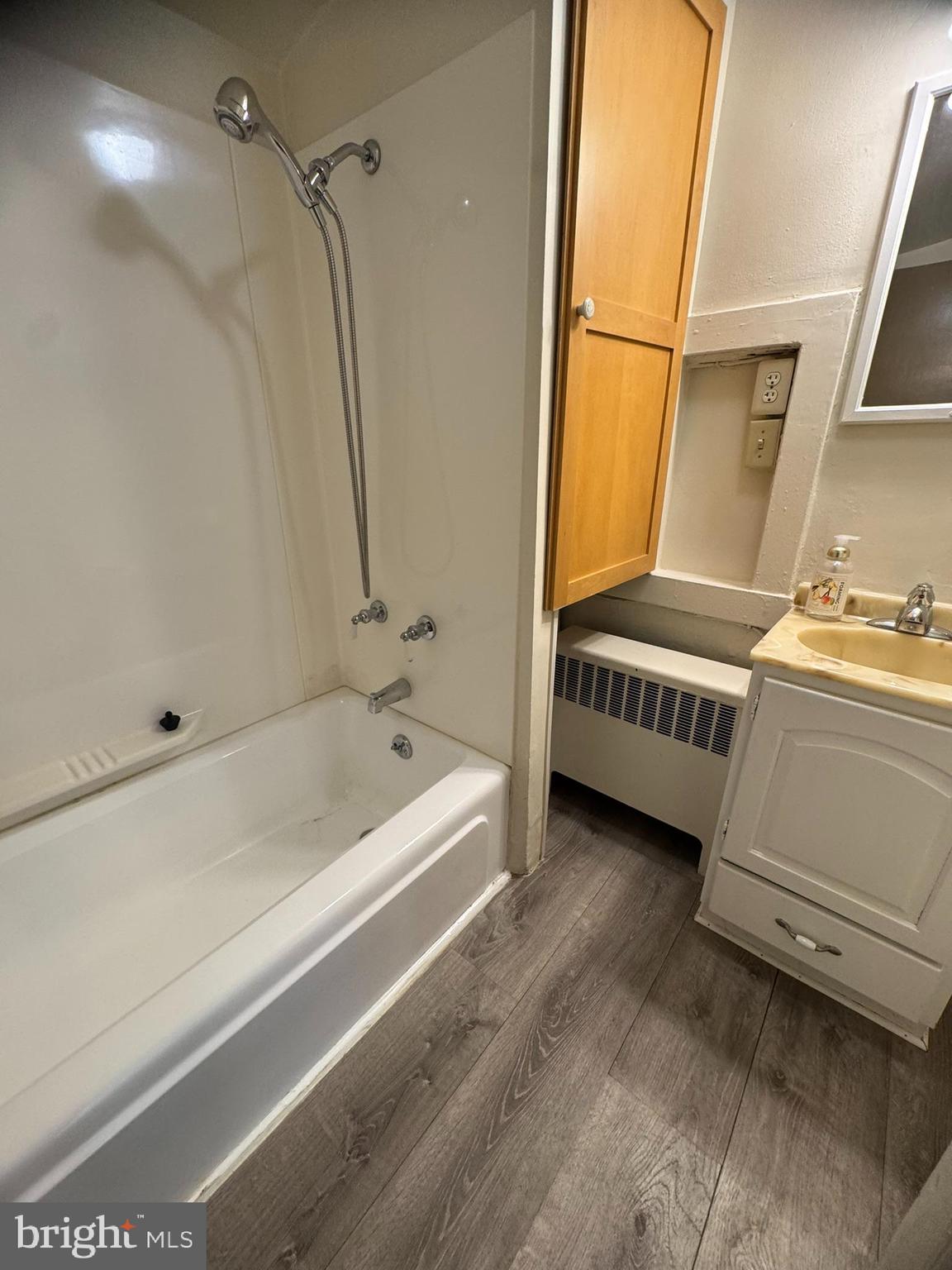 125 South Bentz Street Frederick, MD 21701 - Photo 7 of 16 a bathroom with a sink a bathtub and a shower