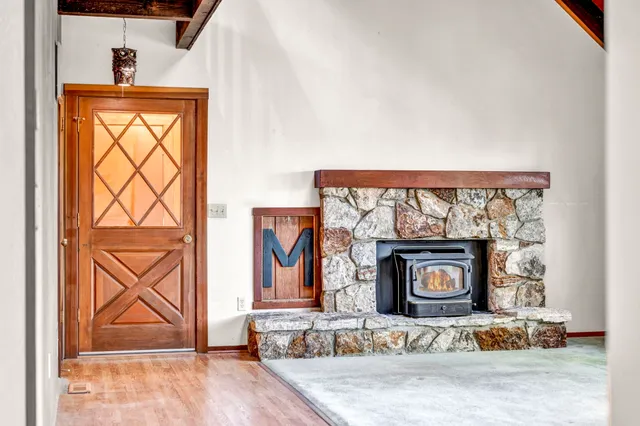 a view of an entryway with wooden floor