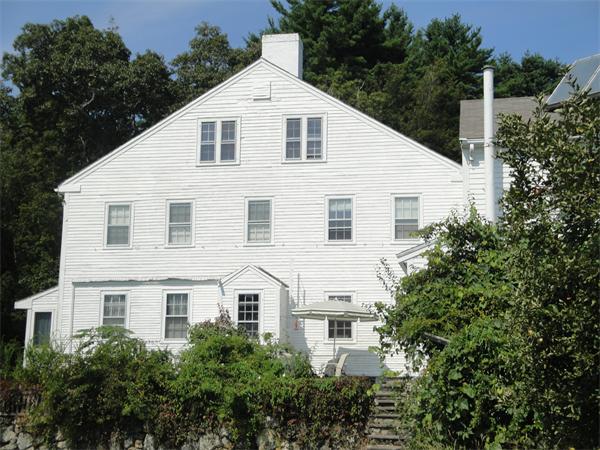 35 Ipswich Road Boxford, MA 01921 - Photo 4 of 18 a view of a white house with large windows and plants