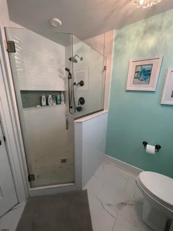 a room with walk in closet and wooden floor