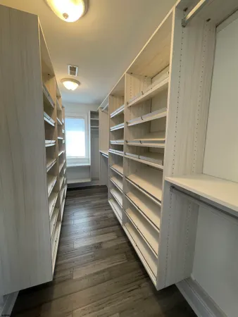 a view of a patio with table and chairs under an umbrella