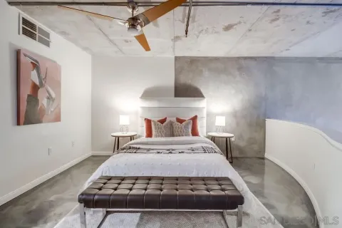 a bedroom with a bed and a table