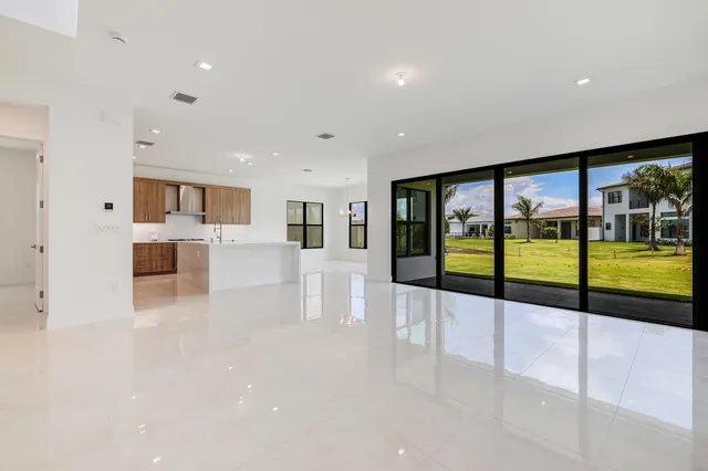 a view of an entryway with a floor to ceiling window and an entryway