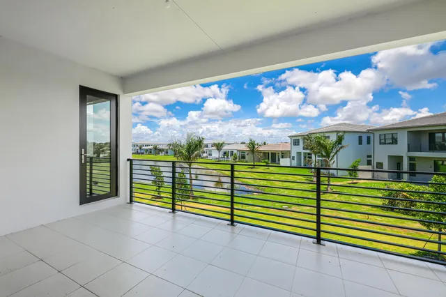 an aerial view of a house with a swimming pool