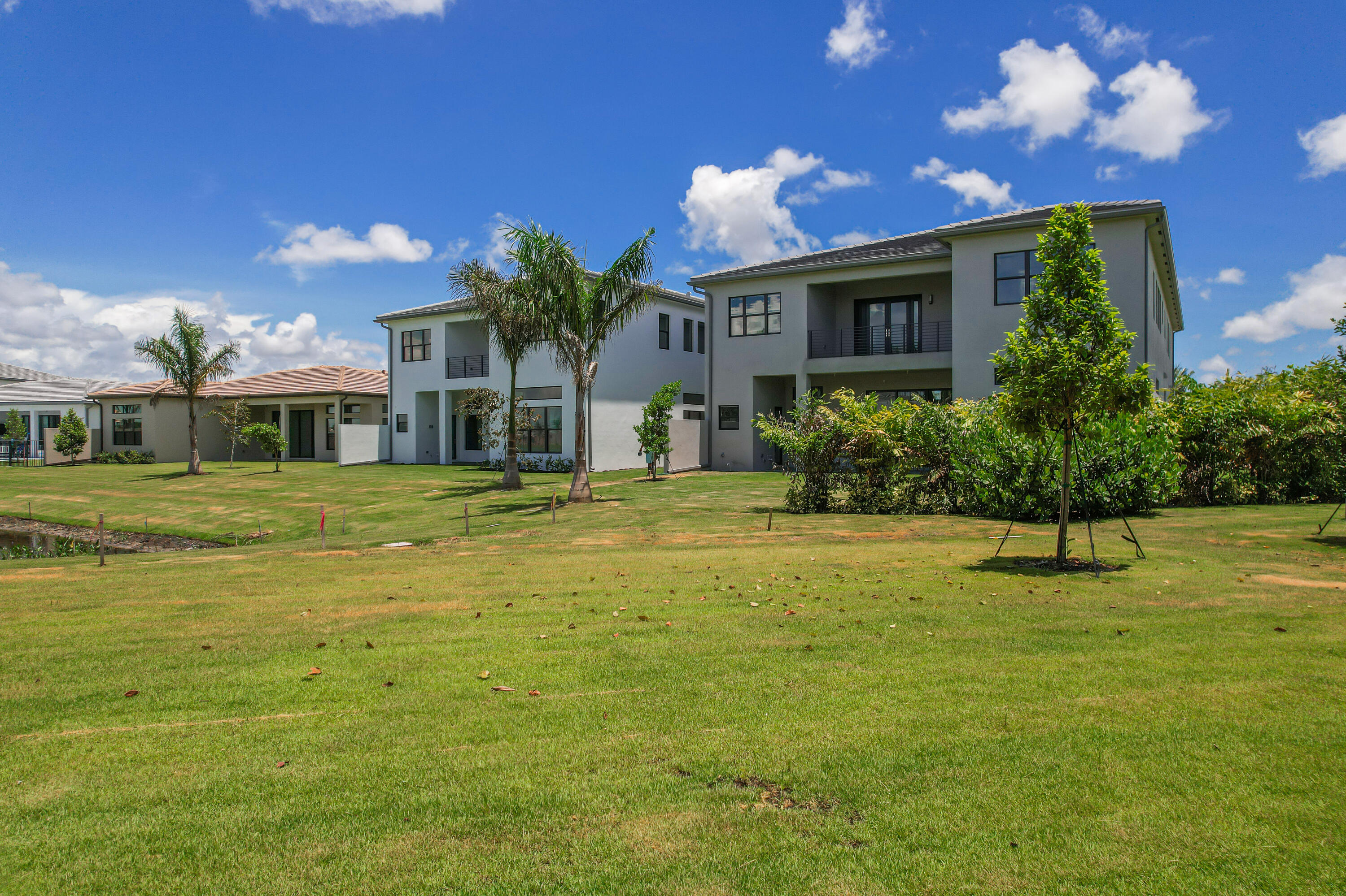 9451 Riverside Pk Drive Boca Raton, FL 33434 - Photo 56 of 71 a front view of a house with a yard