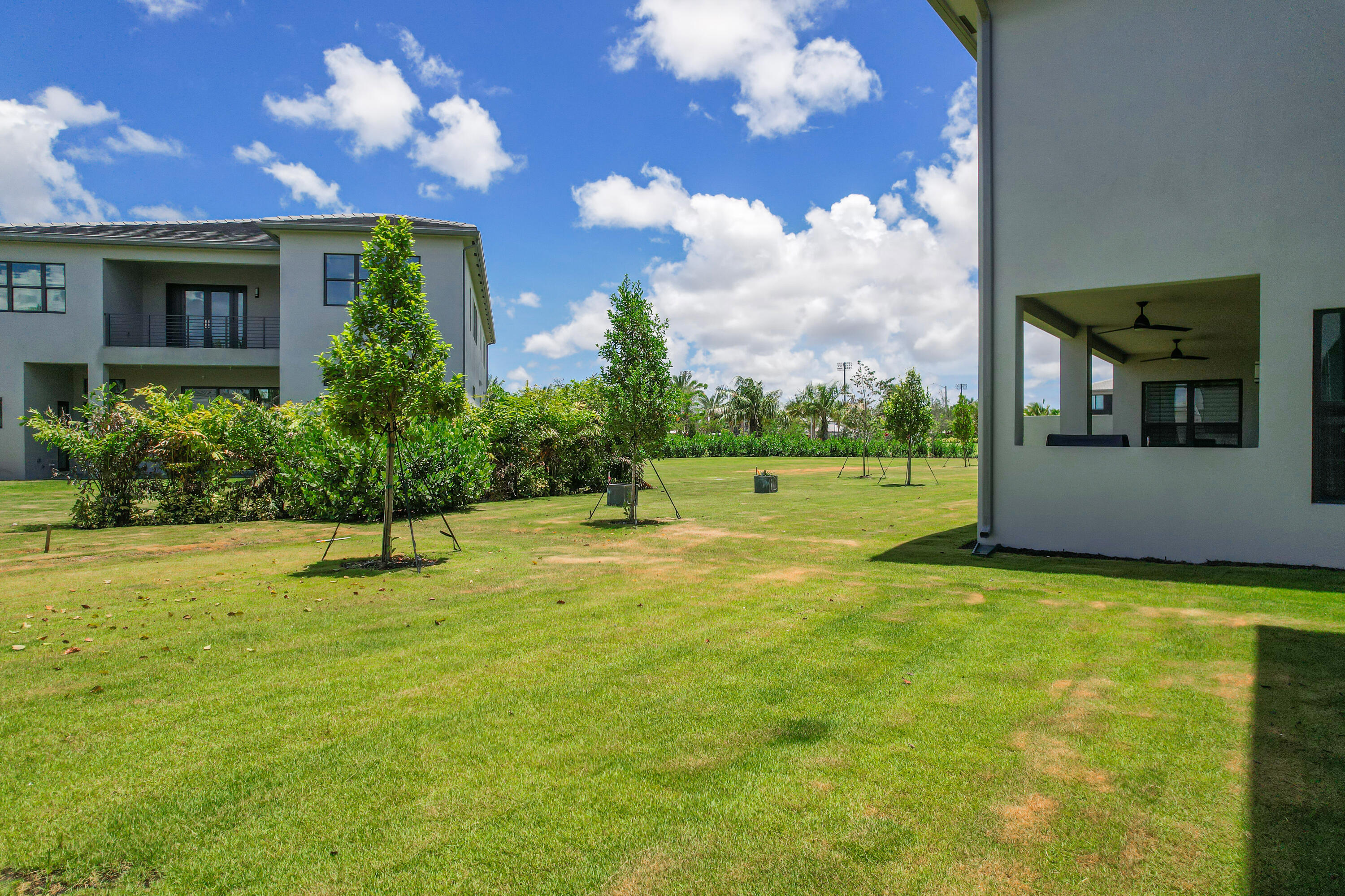 9451 Riverside Pk Drive Boca Raton, FL 33434 - Photo 57 of 71 a view of an house with backyard and a tree