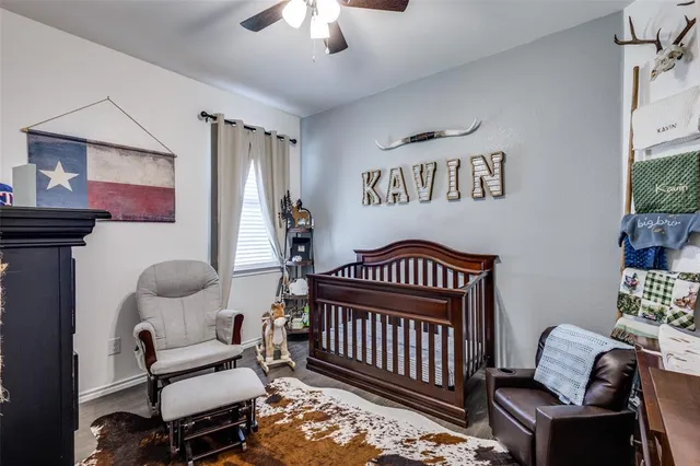 a bedroom with furniture and a window