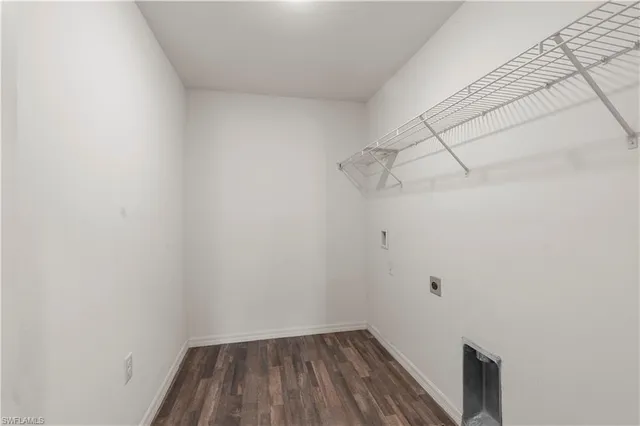 a view of kitchen with furniture and refrigerator