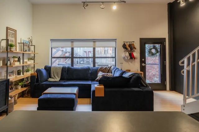 a living room with furniture and a window