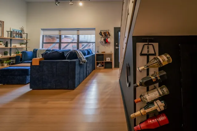 a living room with furniture a ceiling fan and a rug