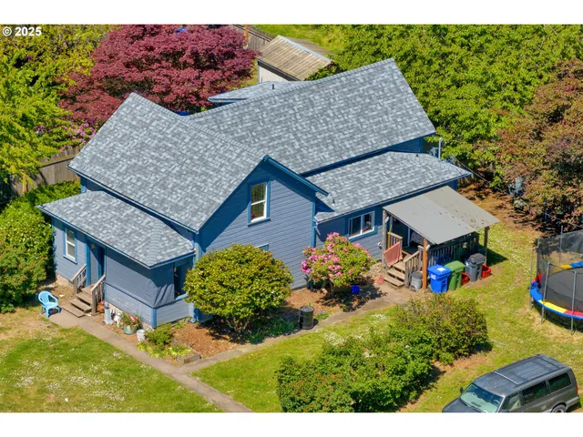 an aerial view of a house with garden