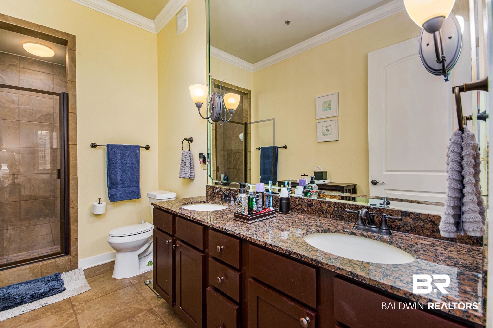 1430 Regency Road, Unit I201 Gulf Shores, AL 36542 - Photo 18 of 34 Bathroom featuring toilet, walk in shower, tile patterned flooring, ornamental molding, and vanity