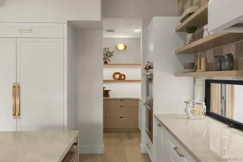 a kitchen with a cabinets and a wooden floor