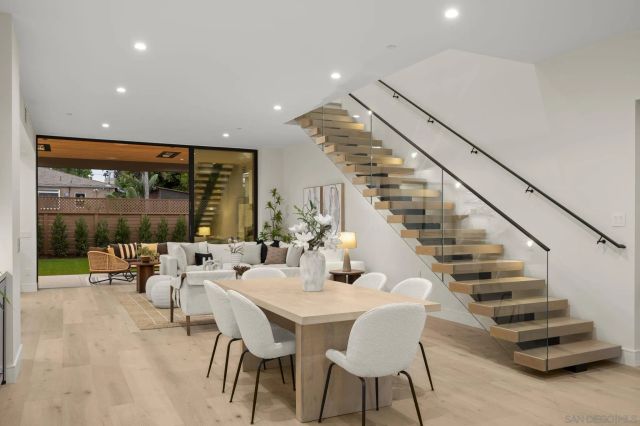 a view of a living room and a balcony