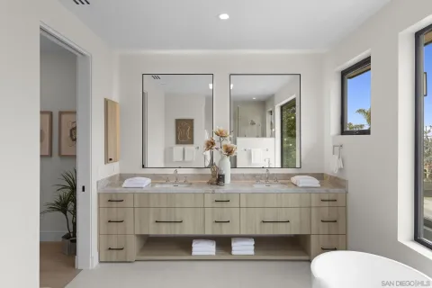 a bathroom with a sink a toilet a shower curtain and a bath tub