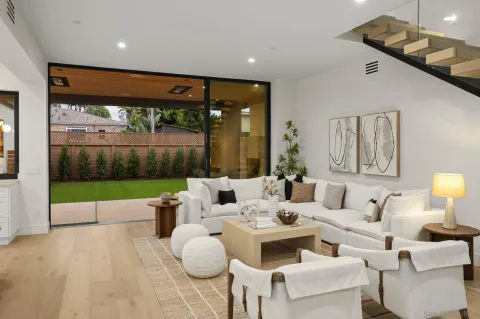 a living room with furniture gym equipment and a fireplace