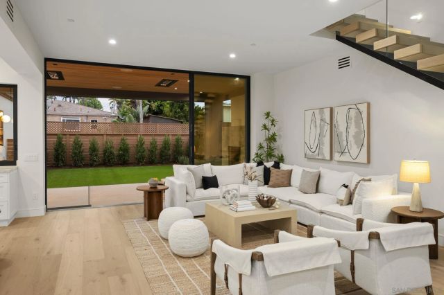 a living room with furniture gym equipment and a fireplace