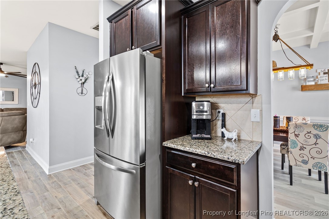 121 Colonist Place Cameron, NC 28326 - Photo 14 of 46 a kitchen with granite countertop stainless steel appliances a refrigerator stove and sink