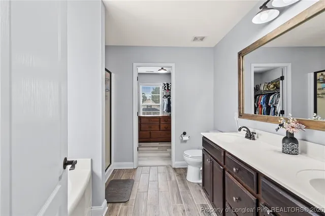 a white bath tub sitting in a bathroom