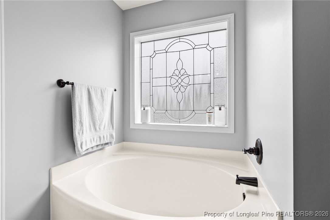 121 Colonist Place Cameron, NC 28326 - Photo 28 of 46 a white bath tub sitting in a bathroom