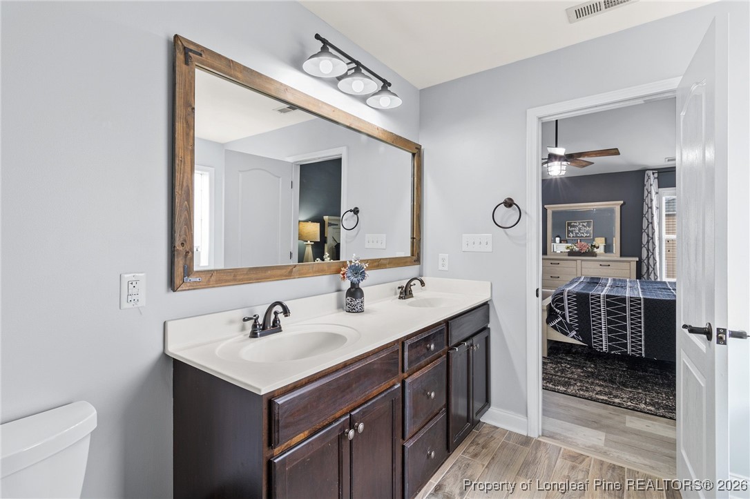 121 Colonist Place Cameron, NC 28326 - Photo 29 of 46 a bathroom with a sink and a mirror