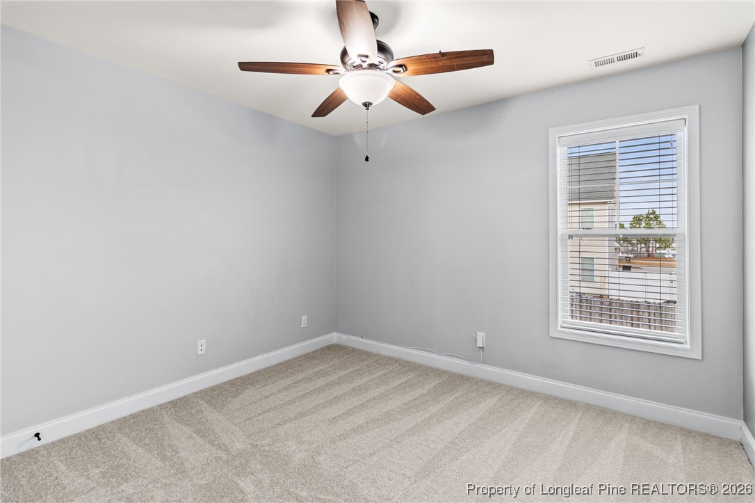 121 Colonist Place Cameron, NC 28326 - Photo 32 of 46 an empty room with windows and fan