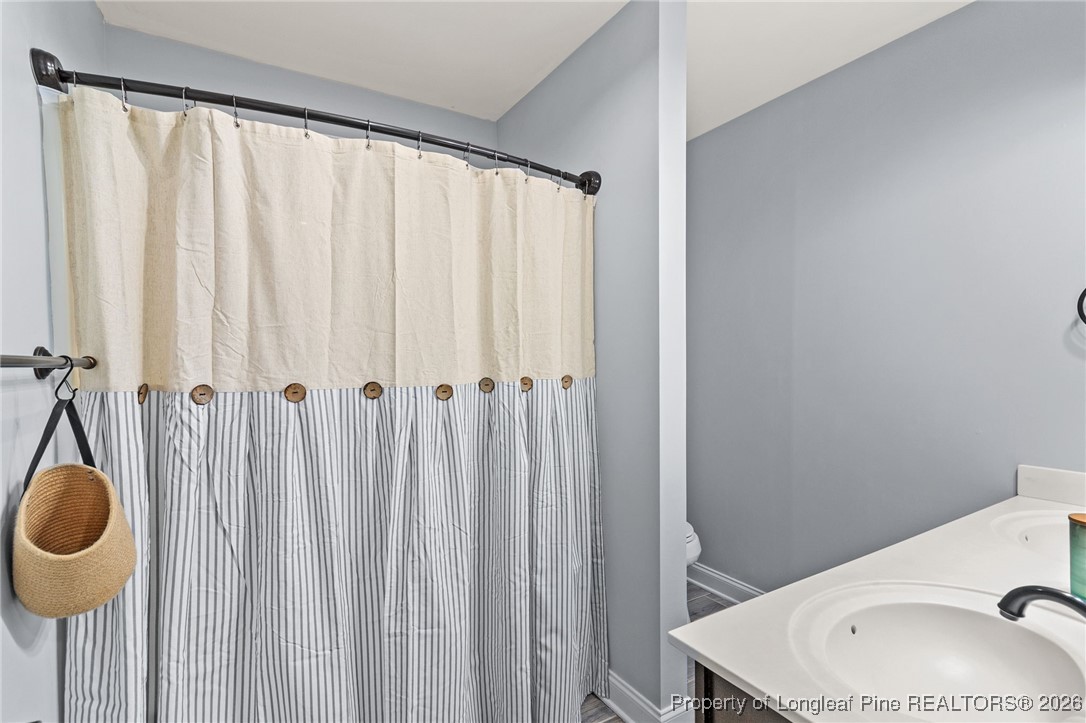 121 Colonist Place Cameron, NC 28326 - Photo 34 of 46 a bathroom with a sink toilet and shower