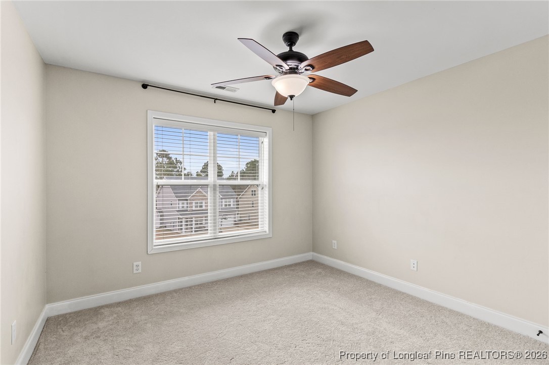 121 Colonist Place Cameron, NC 28326 - Photo 36 of 46 an empty room with windows and fan