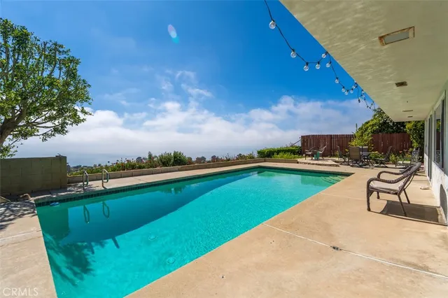 a view of swimming pool from a balcony