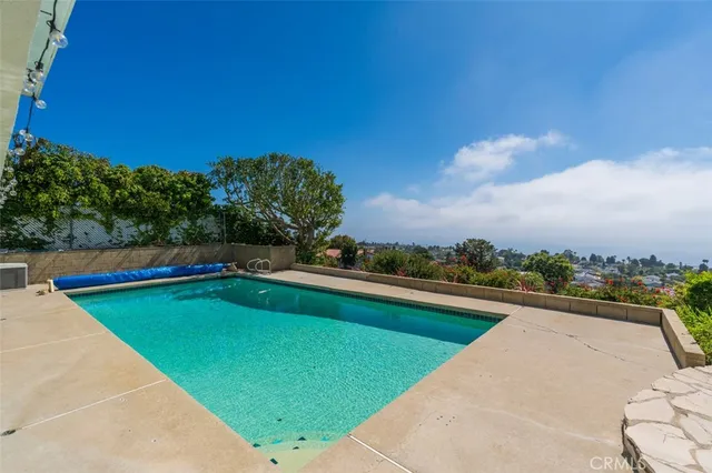 a view of swimming pool with a yard