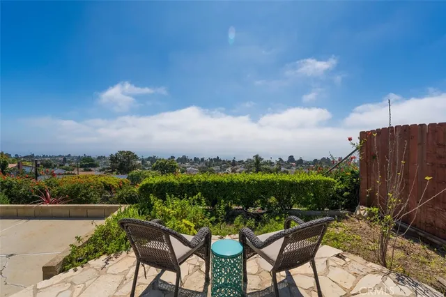 a view of a chairs and table in the terrace