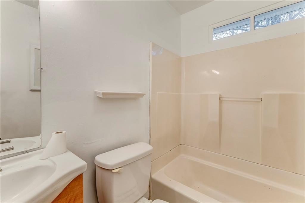 2888 Old Summerville Road Armuchee, GA 30105 - Photo 12 of 37 a bathroom with a sink a toilet and shower