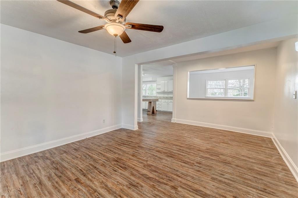2888 Old Summerville Road Armuchee, GA 30105 - Photo 19 of 37 wooden floor in an empty room with a window