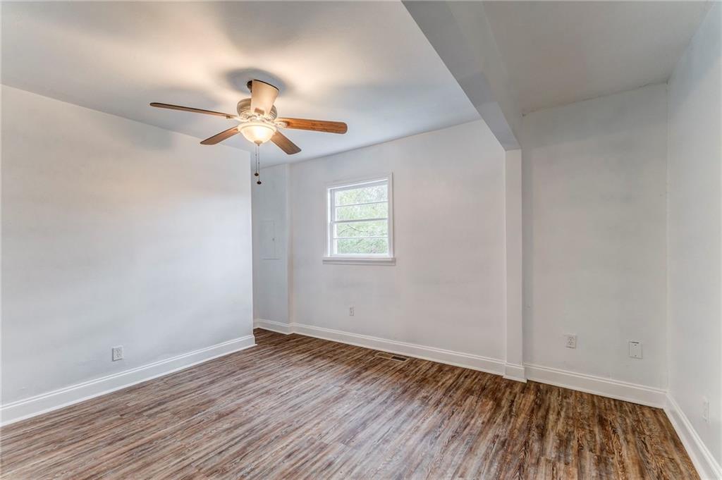 2888 Old Summerville Road Armuchee, GA 30105 - Photo 21 of 37 wooden floor in an empty room with a window