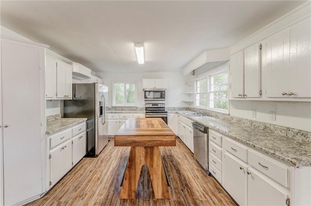 2888 Old Summerville Road Armuchee, GA 30105 - Photo 27 of 37 a large kitchen with cabinets