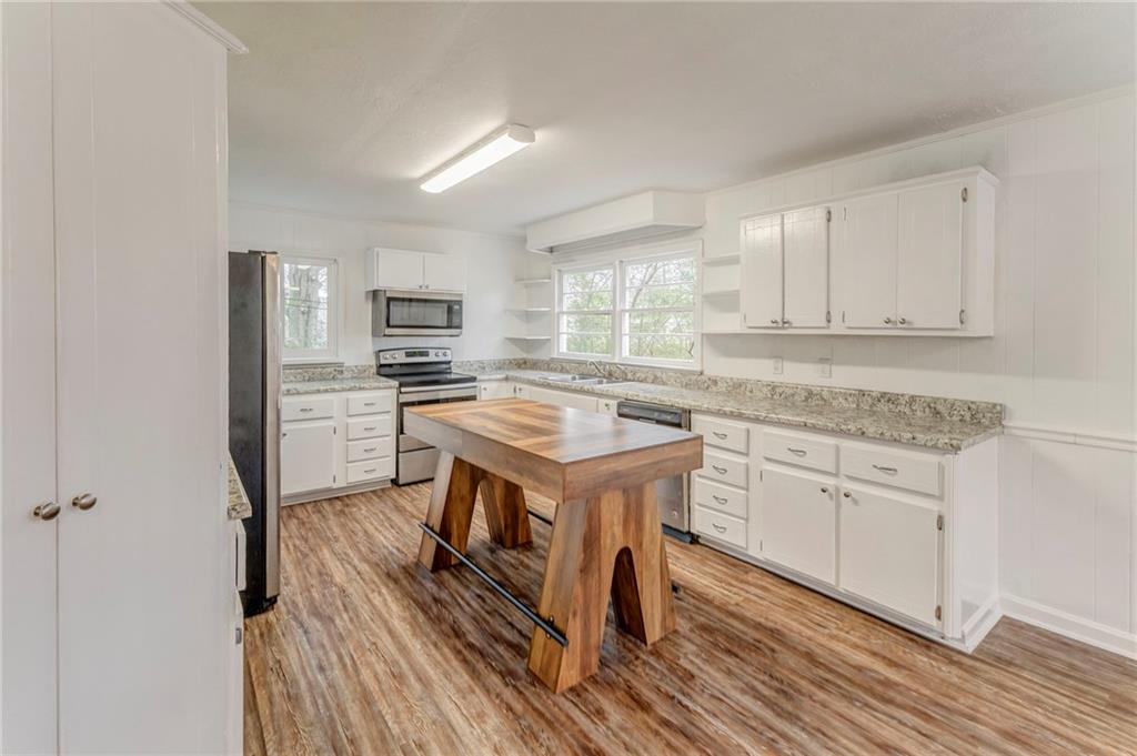 2888 Old Summerville Road Armuchee, GA 30105 - Photo 28 of 37 a kitchen with a sink stove and refrigerator