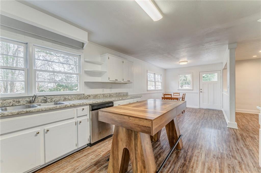 2888 Old Summerville Road Armuchee, GA 30105 - Photo 32 of 37 a kitchen with a sink stove and cabinets