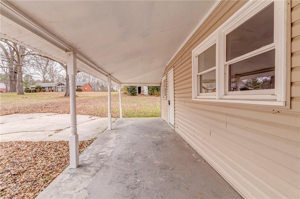 2888 Old Summerville Road Armuchee, GA 30105 - Photo 34 of 37 a view of a porch with a bench