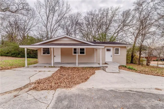a house with trees in the background