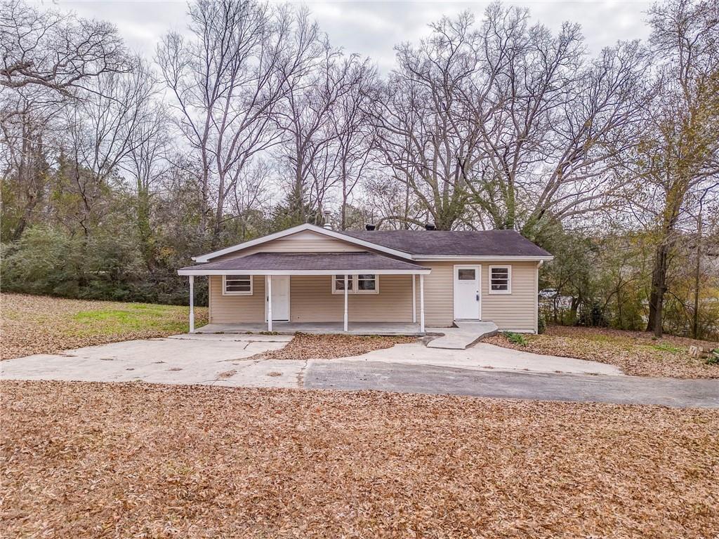 2888 Old Summerville Road Armuchee, GA 30105 - Photo 6 of 37 a front view of a house with a yard