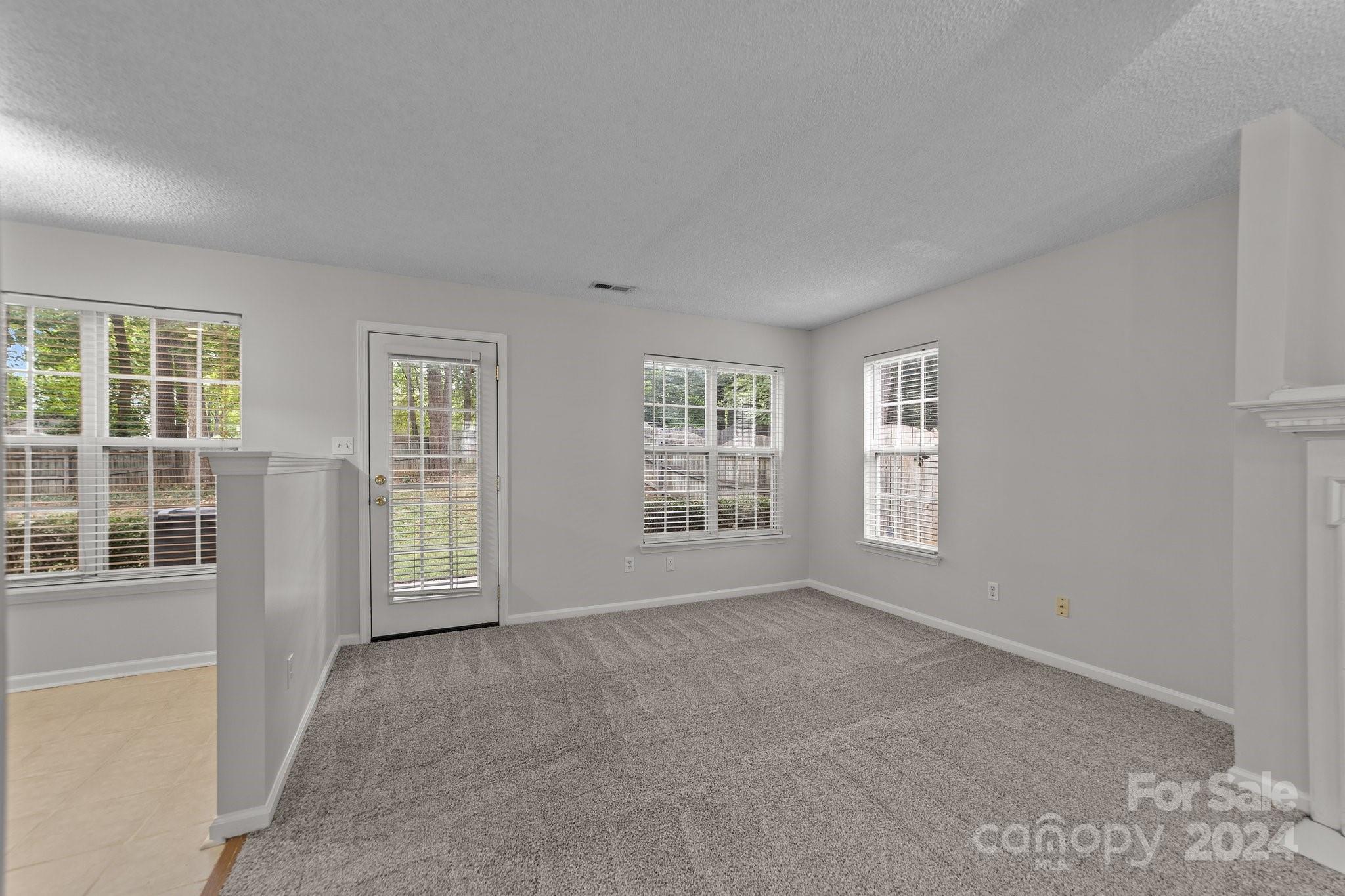 8424 Conner Ridge Lane Charlotte, NC 28269 - Photo 14 of 48 a view of an empty room with a window