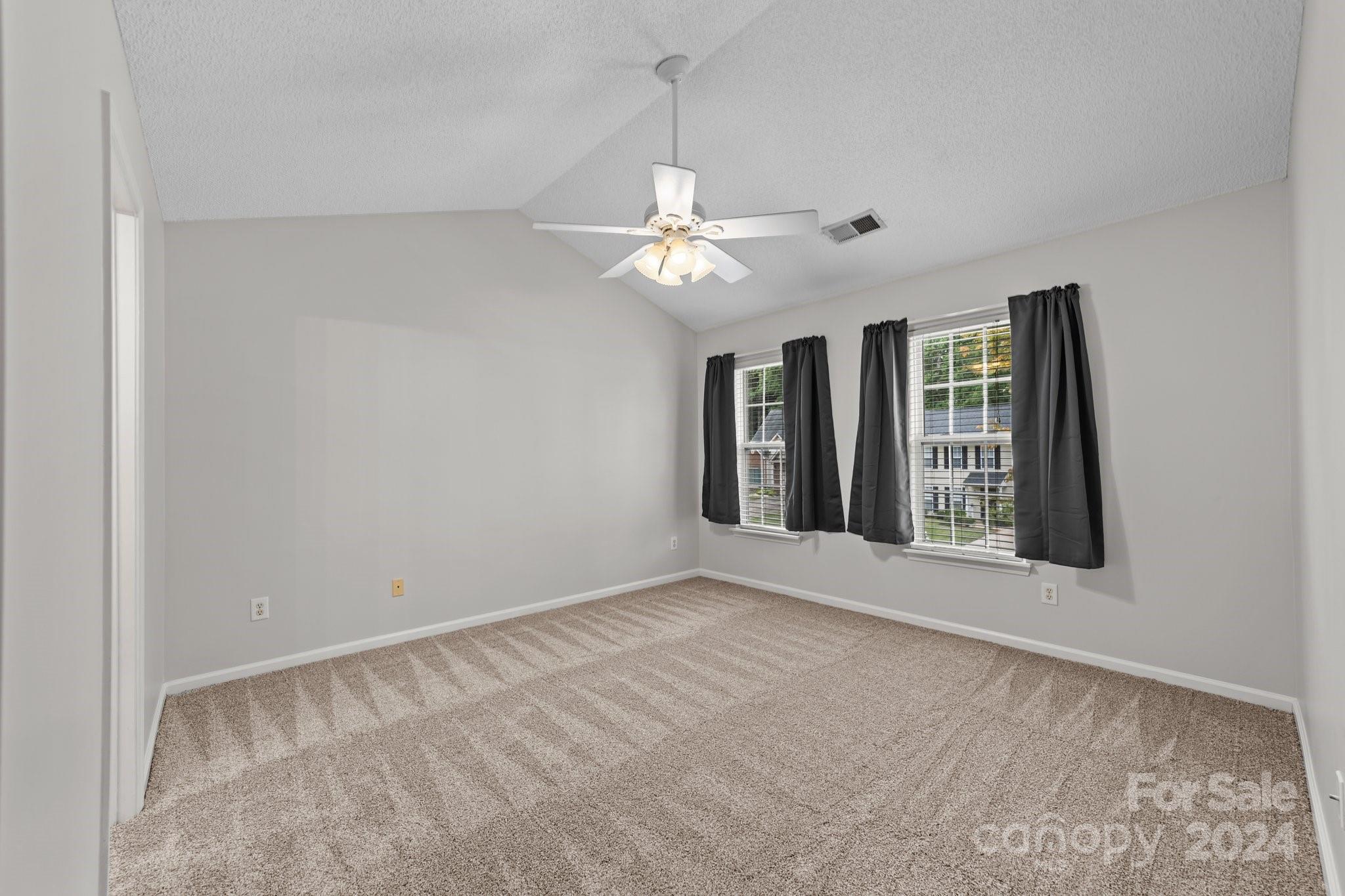 8424 Conner Ridge Lane Charlotte, NC 28269 - Photo 24 of 48 a view of an empty room with a window