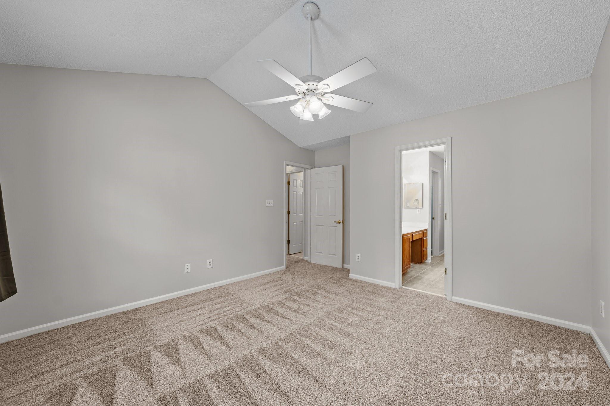 8424 Conner Ridge Lane Charlotte, NC 28269 - Photo 25 of 48 an empty room with a fan and a fan
