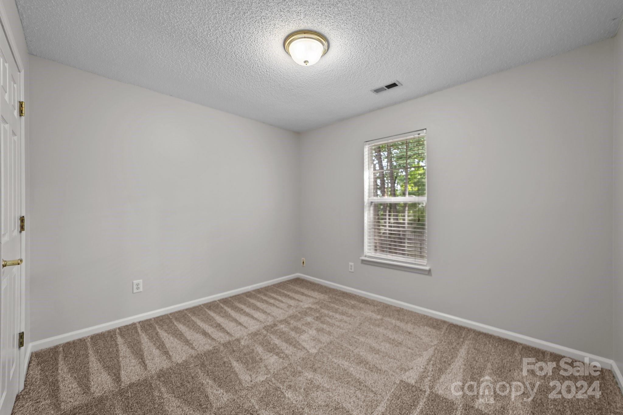 8424 Conner Ridge Lane Charlotte, NC 28269 - Photo 30 of 48 a view of an empty room with a window