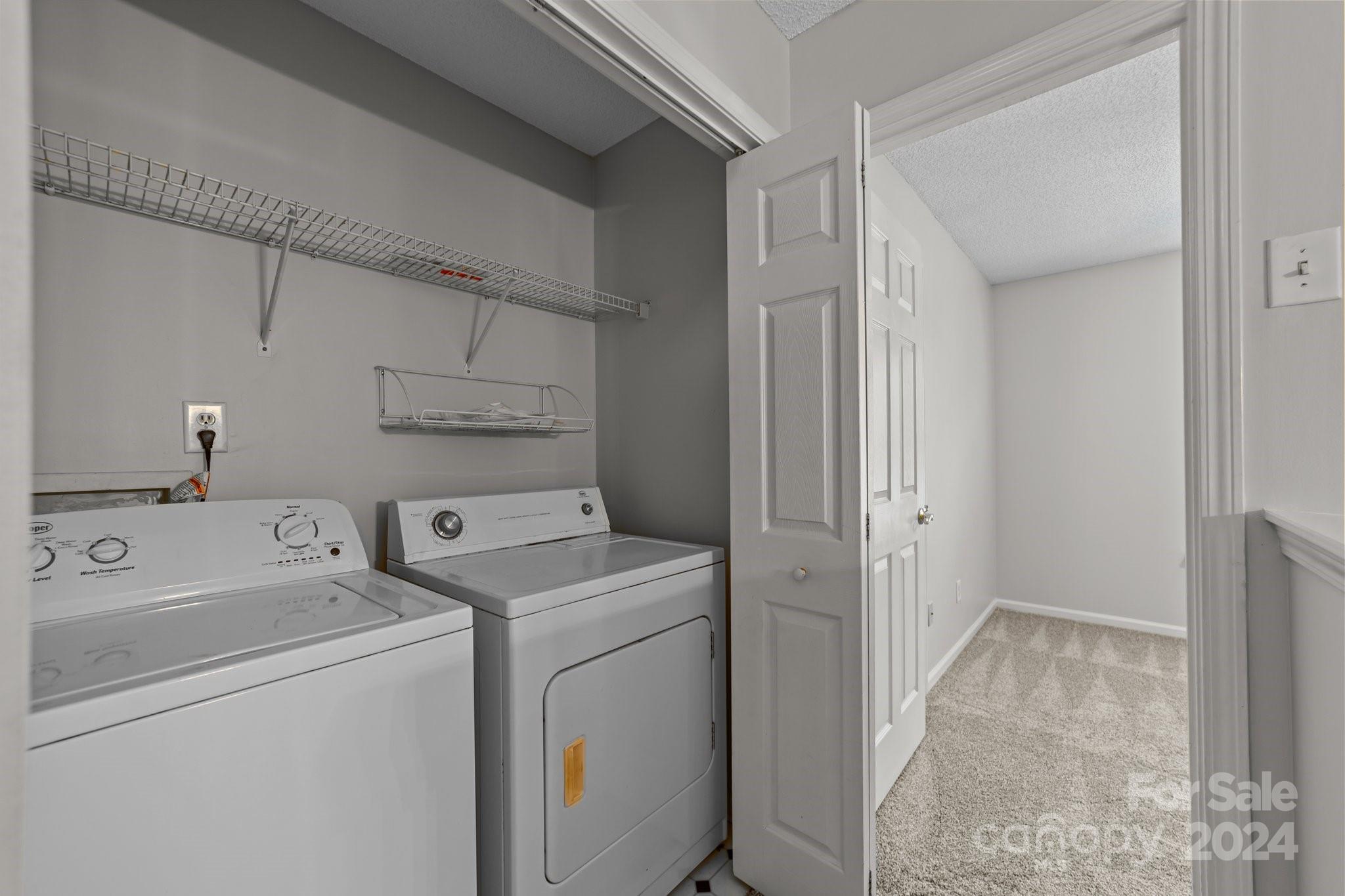 8424 Conner Ridge Lane Charlotte, NC 28269 - Photo 34 of 48 a view of storage and utility room with washer and dryer