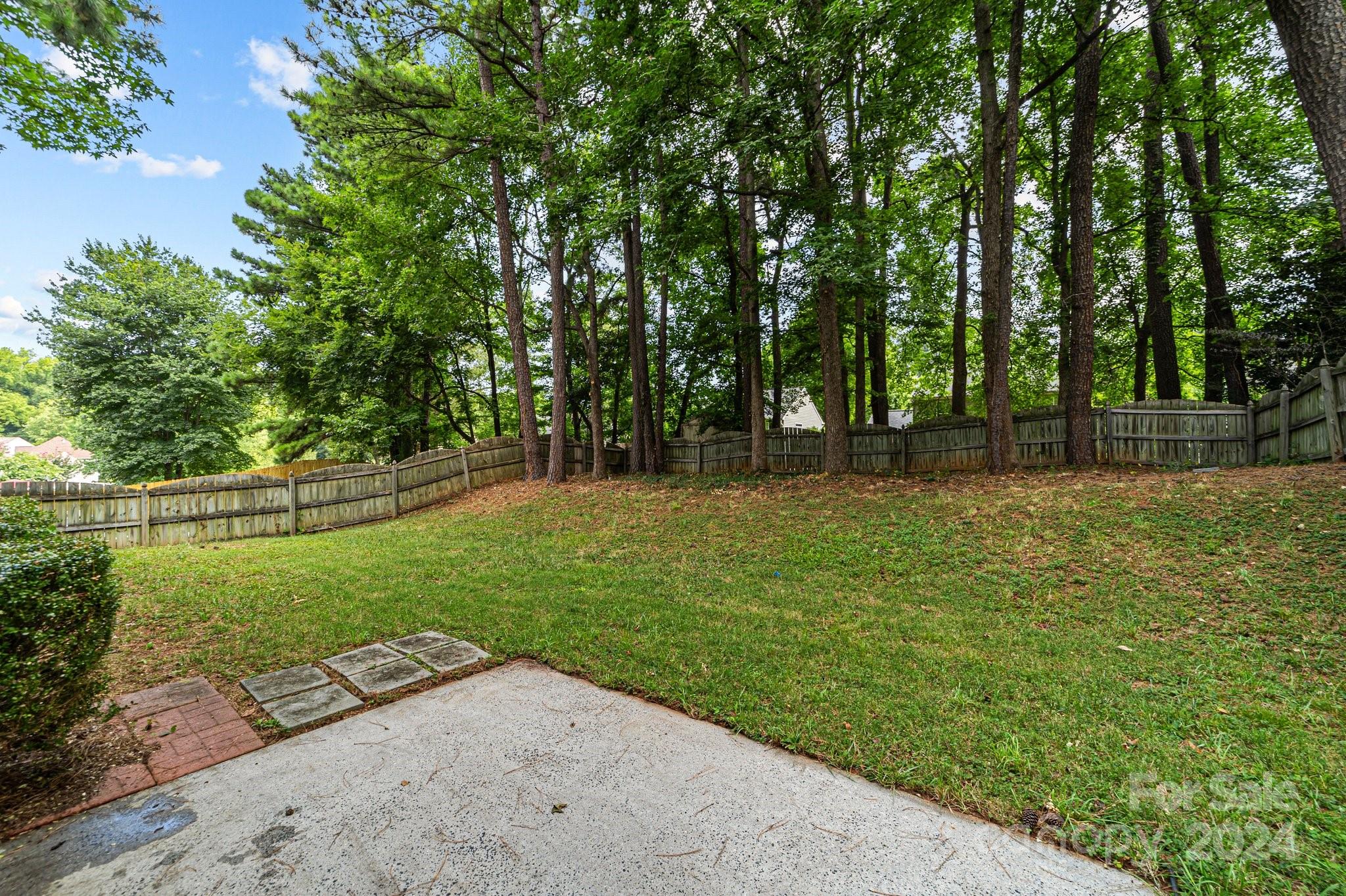 8424 Conner Ridge Lane Charlotte, NC 28269 - Photo 35 of 48 a view of a park with large trees